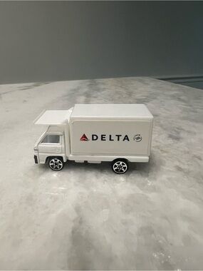 Delta White Mini Delivery Truck Toy with Red Logo